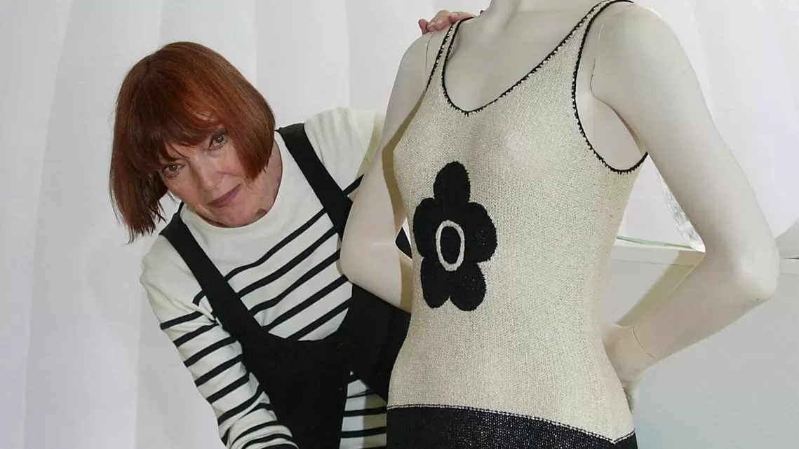 In this file photo taken on 17 June 2004, Mary Quant dresses a model in an outfit, in Paris.