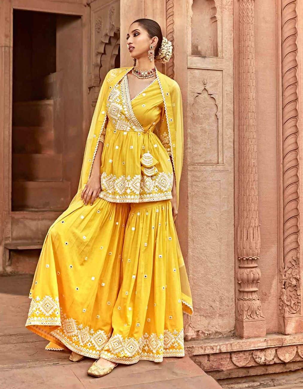 Fariba Kurta Set: The hand-embroidered contrast yoke and metallic cuffs make this lime yellow velvet kurta stand out from the crowd. Available on Rajiramniq.com;